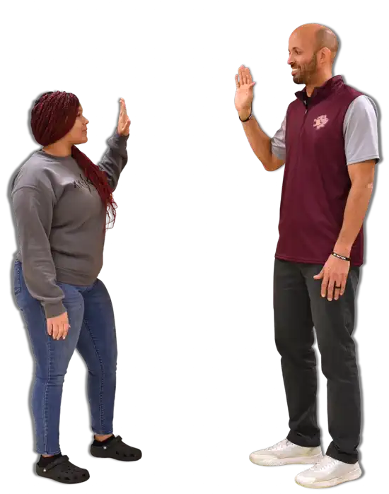 Student and teacher sharing a high five during a School-Connect activity